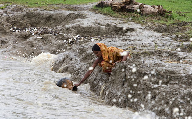 Christian Aid on water: World Water Day: River bank swallows up possessions, Bangladesh