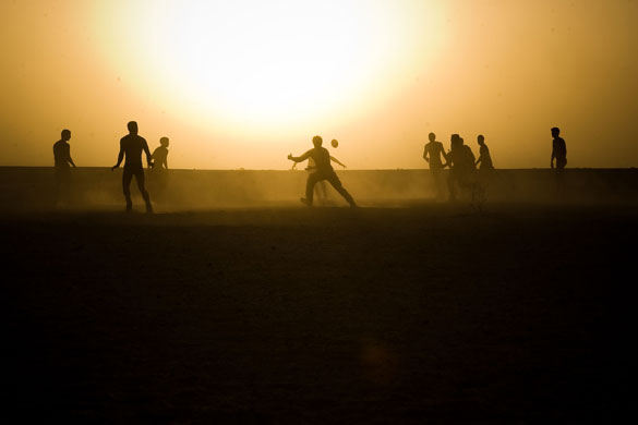 20 March 2009: Helmand Province, Afghanistan: Royal Marines play an impromtu game of rugby
