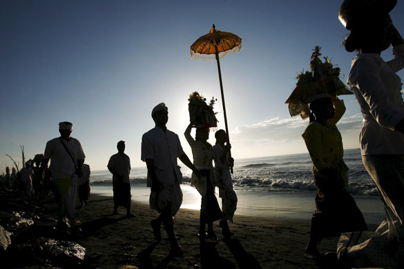 24 hours: Balinese Hindu devotees carry a 'Pratima'