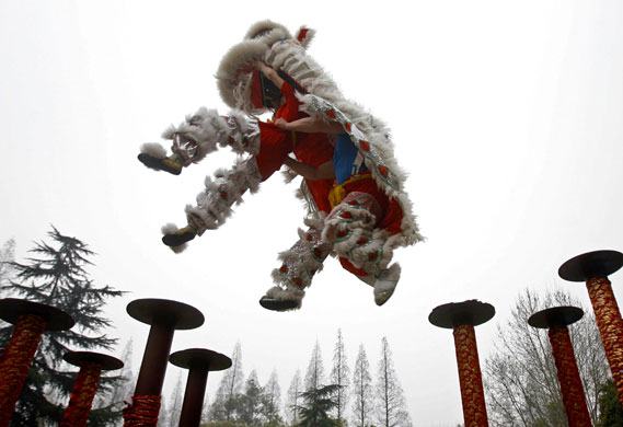 24 hours: Soldiers of People's Liberation Army practise lion dancing