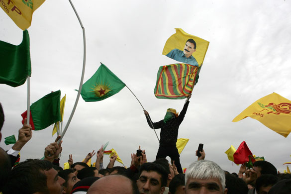 25 March 2009: Turkey: A demostrator displays an image of Kurdish leader, Abdullah Ocalan