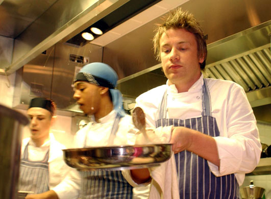 Jamie Oliver: Jamie Oliver at work in the kitchen during the launch of 'Fifteen'