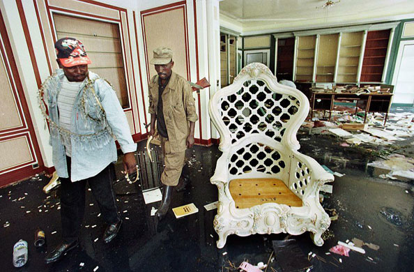 Chris McGreal's Africa: Two looters view the throne of ousted Zairean president Mobutu Sese Seko. 