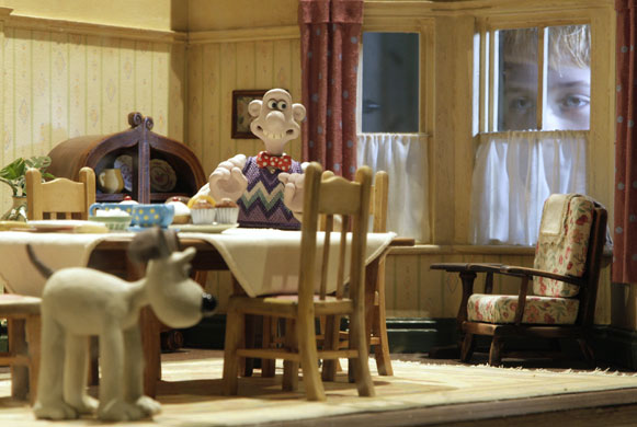 Wallace and Gromit: A child poses by a display of a scene from a Wallace and Gromit film