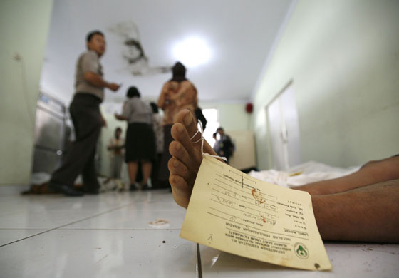 Dam bursts in Indonesia: The body of a victim killed by floods after a dam burst in Jakarta.