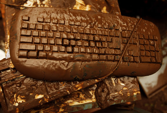 24 hours in pictures: A computer keyboard is covered in mud after floods in Jakarta