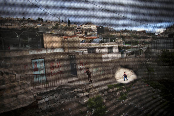 24 hours in pictures: Jerusalem, Israel: A Palestinian boy in the Silwan neighbourhood.