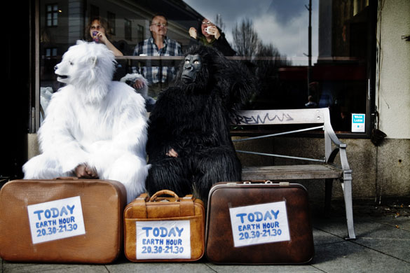 24 hours in pictures: Gothenburg, Sweden: Students participate in Earth Hour climate campaign.