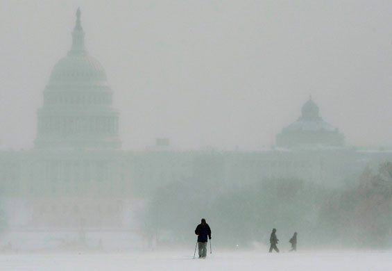 3 March 2009: Washington, US: A man cross country skis across the National mall