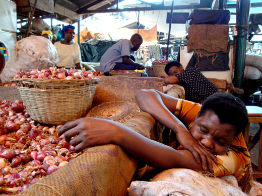 Owino market fire: Traders rest on their stall at Owino market in Kampala, Uganda.