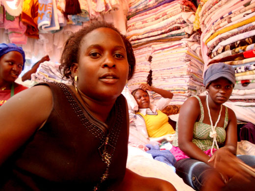 Owino market fire: Women on a stall selling textiles at Owino market in Kampala, Uganda.