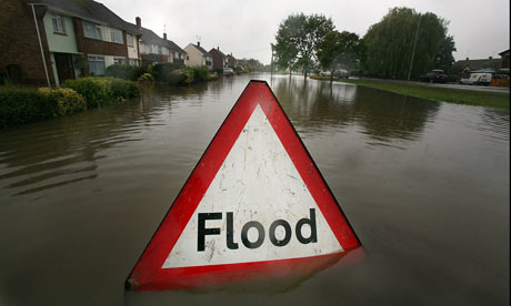 A-flood-sign-warns-of-flo-001.jpg