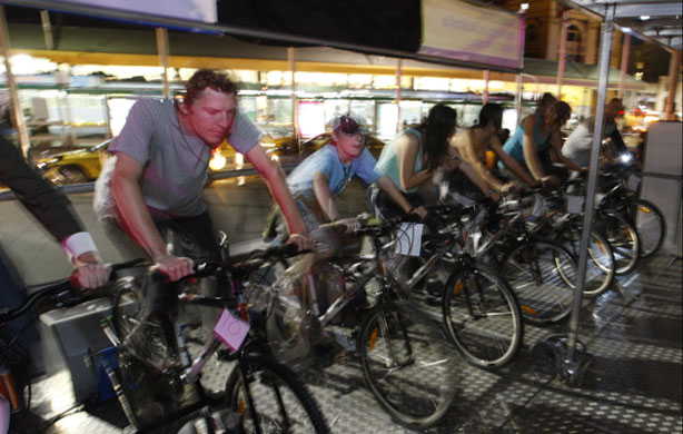 Earth Hour: People ride push bikes in Melbourne, Australia during Earth Hour