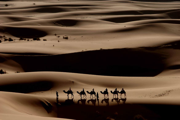 Unseen: Tourists are taken across the Erg Chebbi sand dunes