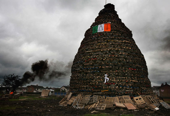 Unseen: A boy climbs on a bonfire on the Ballycraigy estate