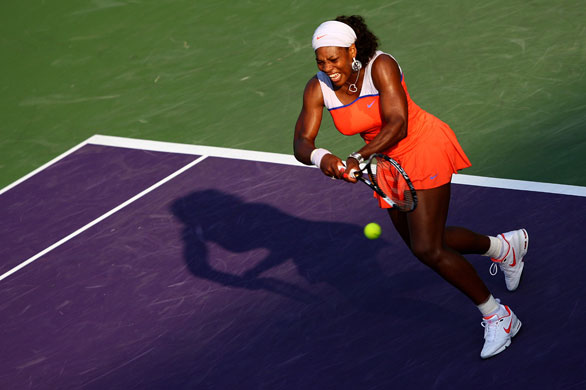 Sport: 24 hours: Serena Williams returns a shot against Jie Zheng of China