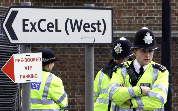 G20 preparation: Police officers stand next to a sign near the ExCeL centre in London