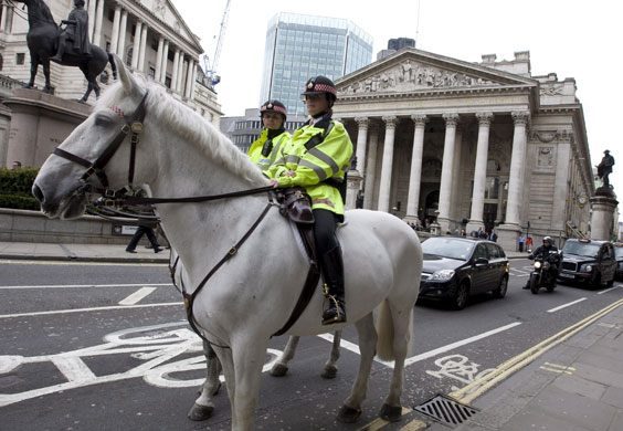 G20 preparation: Mounted police officers patrol in front of the The Bank of England