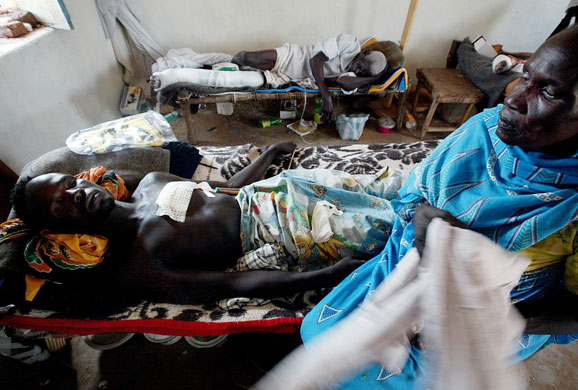 Darfur atrocities: A Sudanese man with bullet wounds from fighting at an MSF clinic.