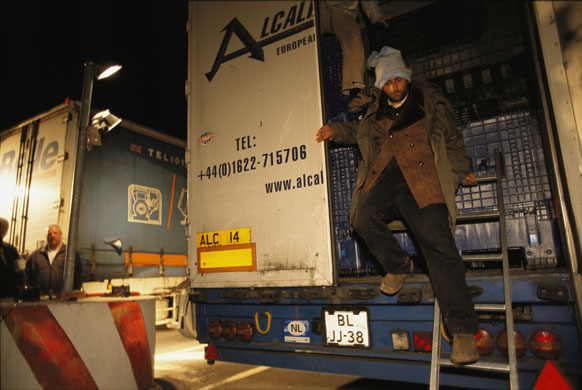 Eurotunnel : Illegal Eastern European immigrants come off a truck at Calais