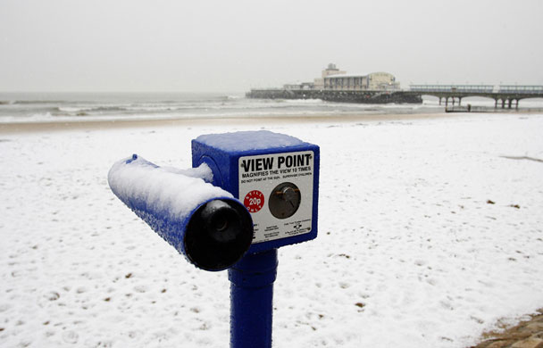 Snow in March: Snow settles on the beach at Bournemouth in Dorset.