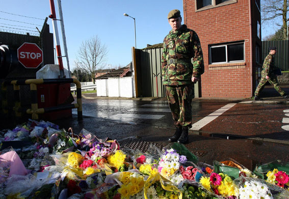 Northern Ireland shooting: Brigadier George Norton looks at the flowers left outside