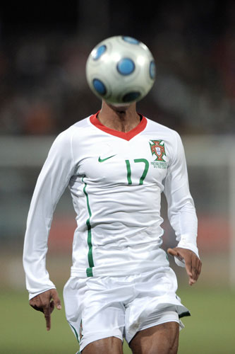 Sport: 24 Hours: Portugal's Nani runs behind the ball during an international friendly