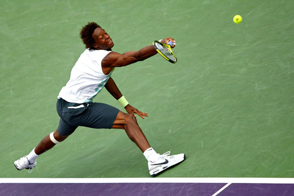 Sport: 24 Hours: Gael Monfils of France misses a return against Andy Roddick