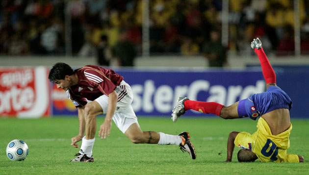 Sport: 24 Hours: Colombia's Macnelly Torres is fouled by Venezuela's Franklin Lucena