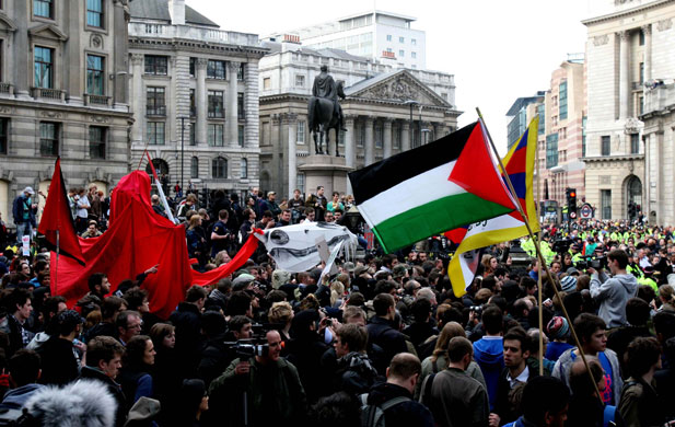 G20 protests and security: Protesters wave flags at Bank in the City of London.