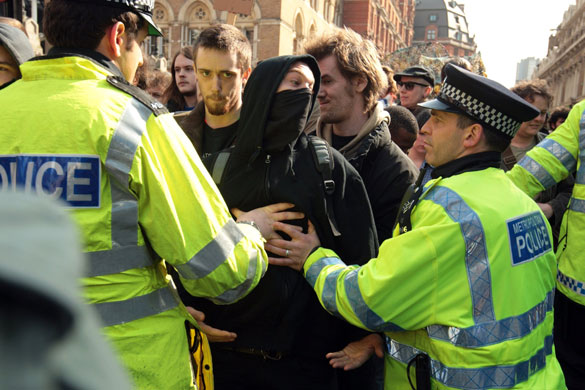 G20 protests and security: Police hold back protesters as they demonstrate against the G20 summit.
