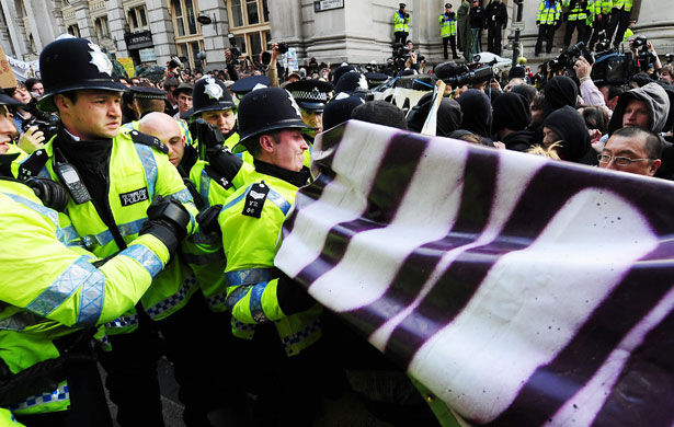 G20 protests and security: Police control protesters outside the Bank of England during G20 protests.