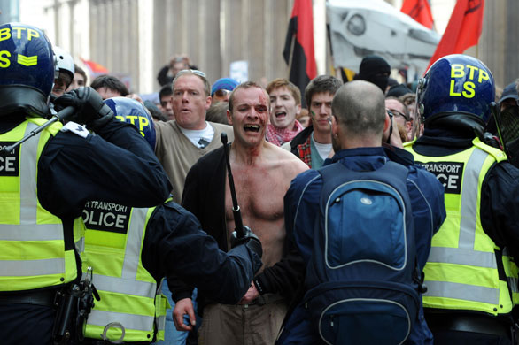 G20 protests and security: A bare-chested man stands up against the police