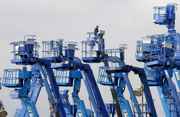 1 April 2009: Kawasaki, Japan: A man works on a crane at a factory