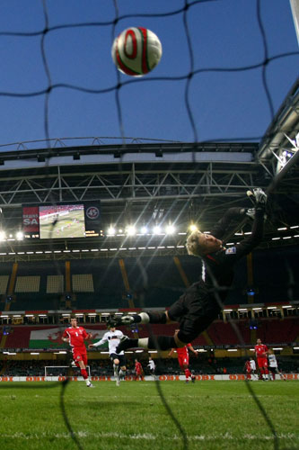 World Cup 2010 Qualifiers: Wales' goalkeeper Wayne Hennessey can't keep out Michael Ballack's shot