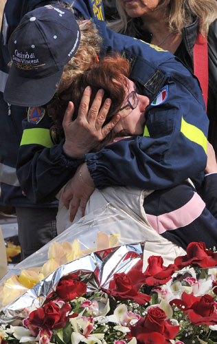 Italy earthquake funerals: Relatives of the victims of the earthquake react at the funeral ceremony