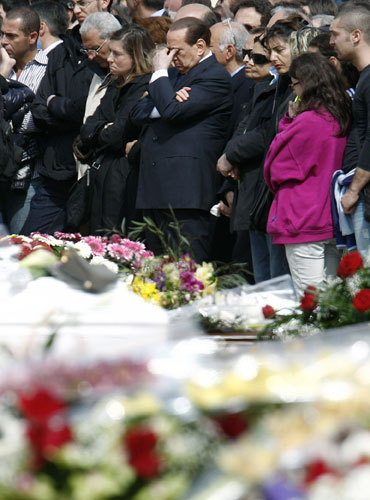 Italy earthquake funerals: Italian Premier Silvio Berlusconi, centre, hides his eyes.