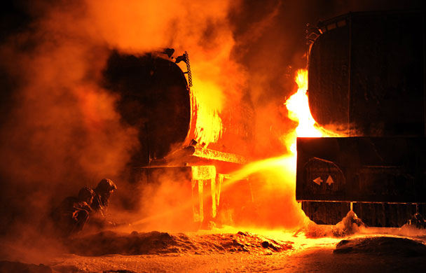 24 hours in pictures: Peshawar, Pakistan: firefighters extinguish burning NATO oil supply tankers