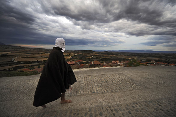 24 hours in pictures: San Vicente de la Sonsierra, Spain: A masked penitent