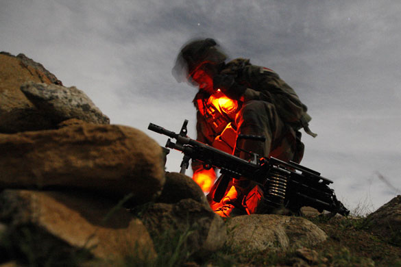 24 hours in pictures: Uzbeen valley, Afghanistan: A French soldier prepares to take position.