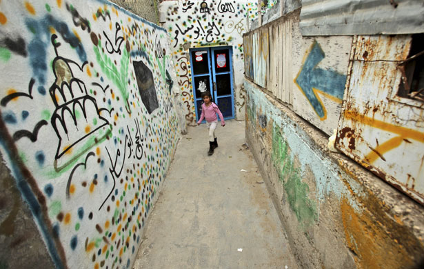 24 hours in pictures: Jerusalem, Israel: A Palestinian girl walks in the Silwan neighbourhood.