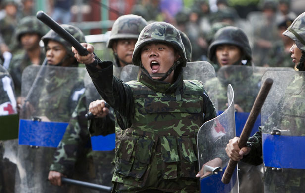 Thailand protests: Thai soldiers shout insults at anti-government demonstrators, in Bangkok.