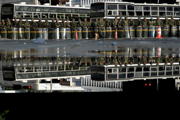 Thailand protests: Thai soldiers secure an area after they charged and fired gun shots.