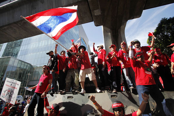 Thailand protests: Anti-government demonstrators take over Thai Army armoured personnel car.