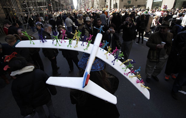 24 hours in pictures: New York, USA: A woman wears a hat during an Easter Parade.