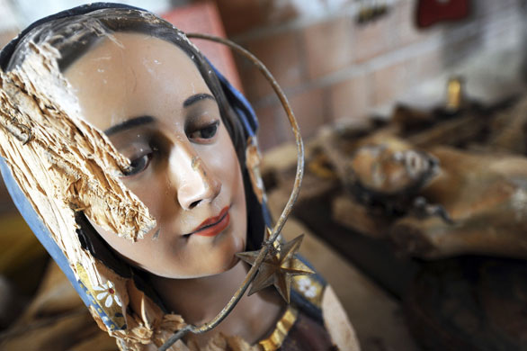 24 hours in pictures: Saint Gregorio, Italy: head of a wooden Madonna, damaged by the earthquake.