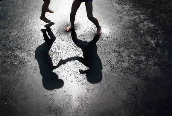 24 hours in pictures: Worpswede, Germany: Boys are silhouetted as they jump on a trampoline.
