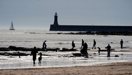 Clear skies and warm temperatures lure holidaymakers to Tynemouth beach.