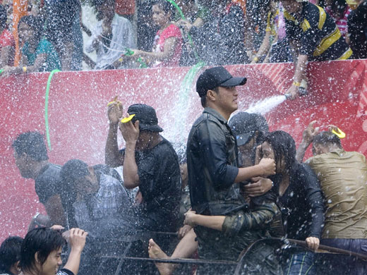 Burma water festival: Young people are sprayed during the annual water festival in Burma.
