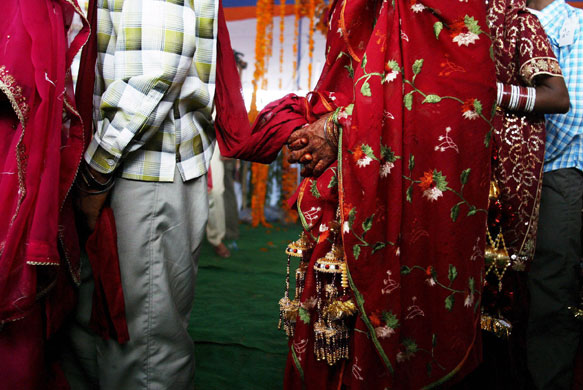14 April 2009: Nashehra Dhalla: A bride holds the wedding ceremony cloth of her groom